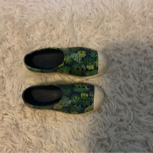 Native shoes with ferns in them.